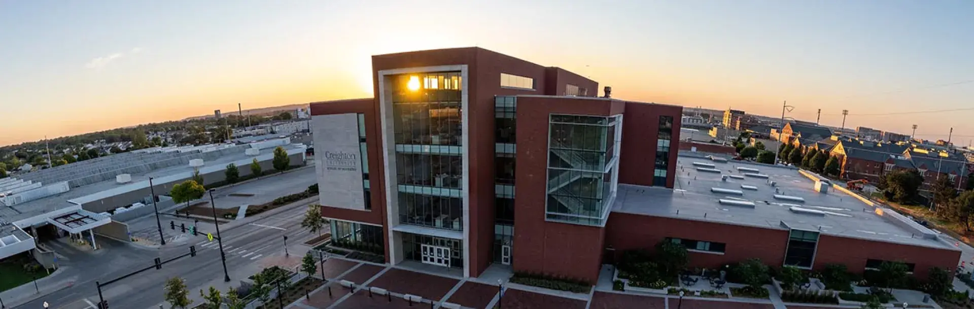 Dental college building with sunrise coming up on the horizon