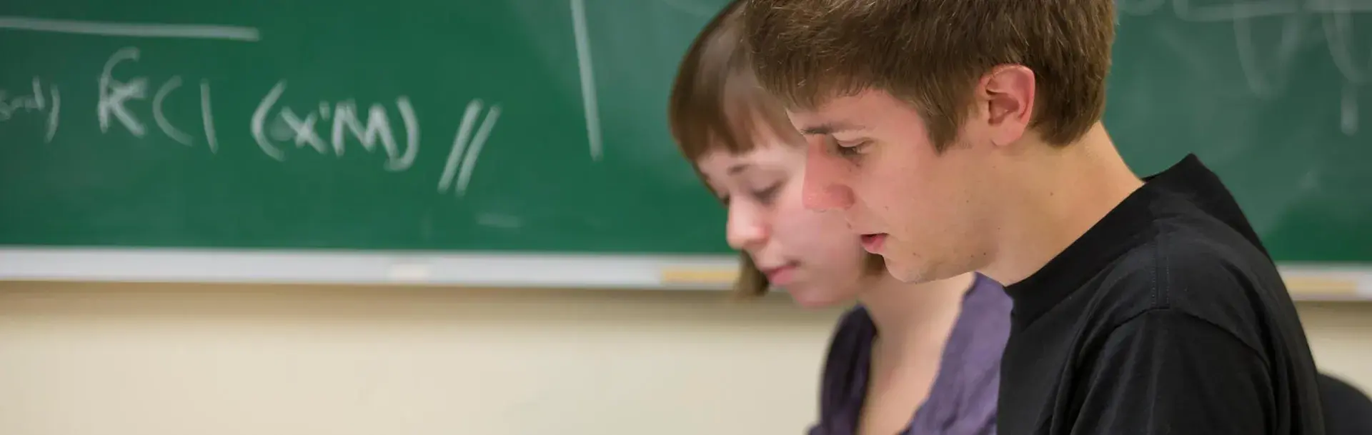 Male and female students in Physics lecture
