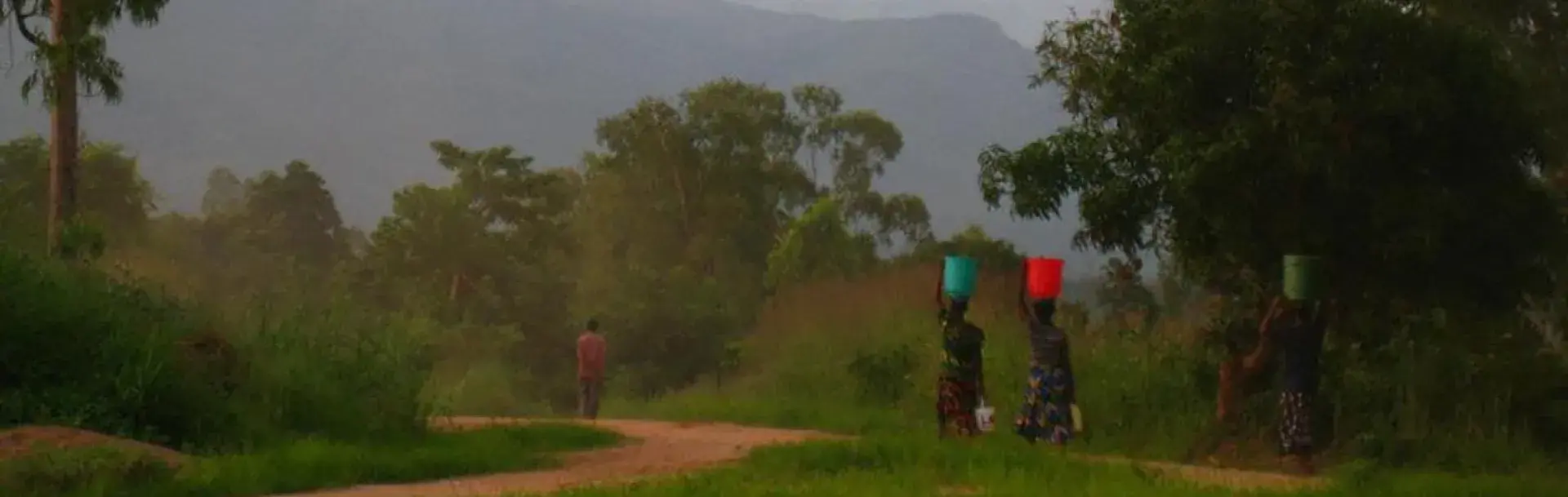 African women carrying water on their heads.