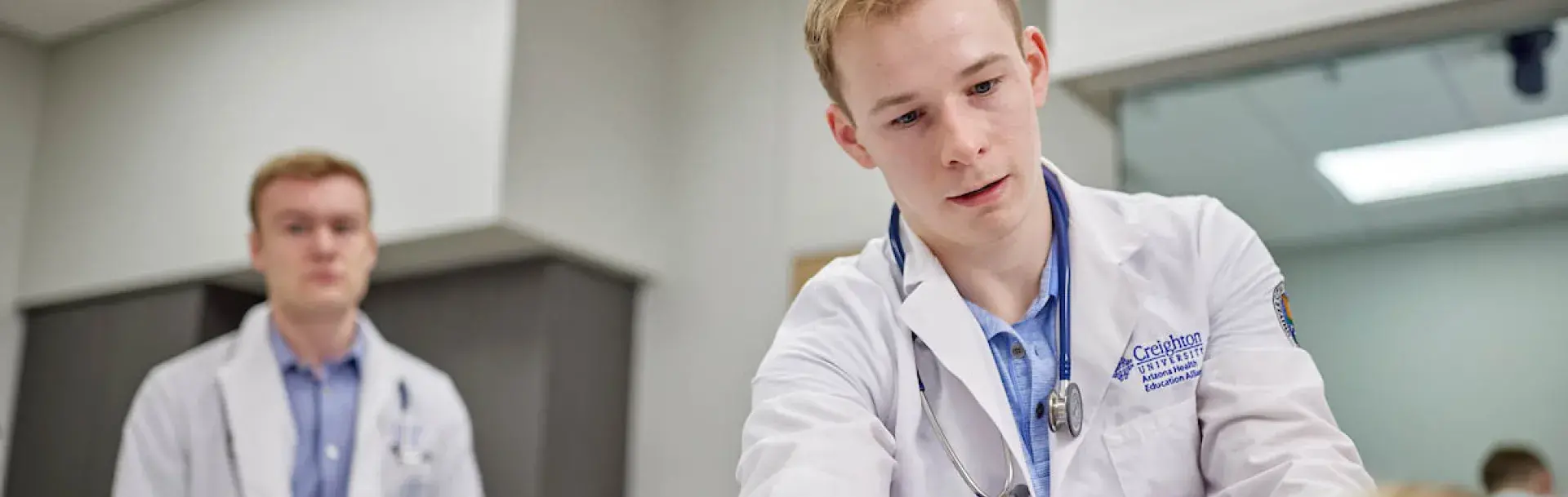 Practicing examination techniques in simulation lab.