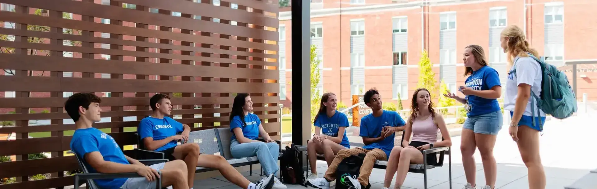 Big group of students socializing in resident hall.