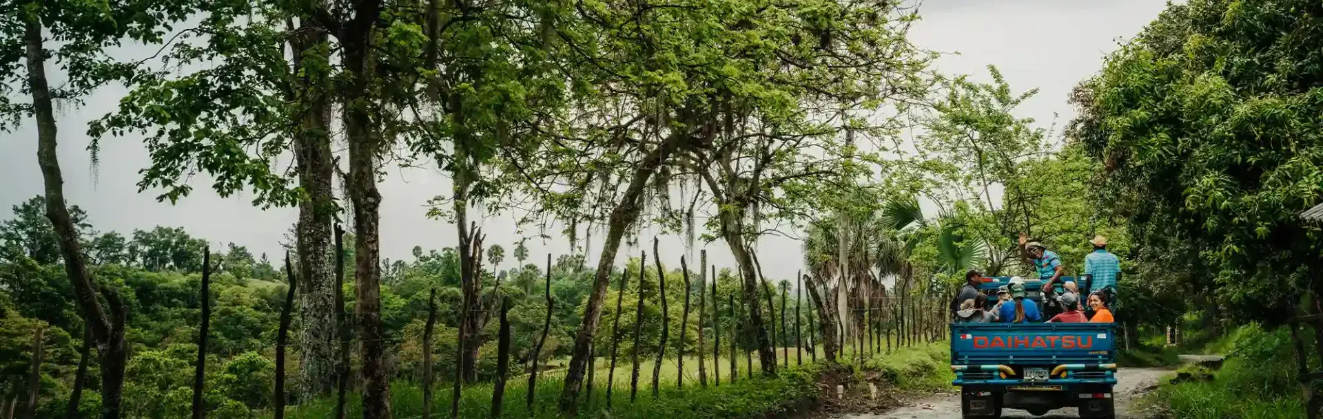 Wide shot of students in vehicle traveling in Dominican Republic.