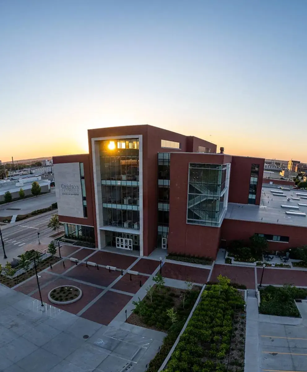 Dental college building with sunrise coming up on the horizon