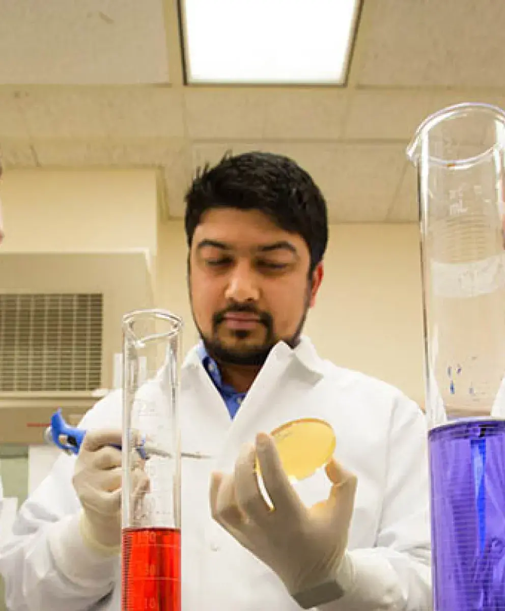 Dental research testing with three researchers in lab.