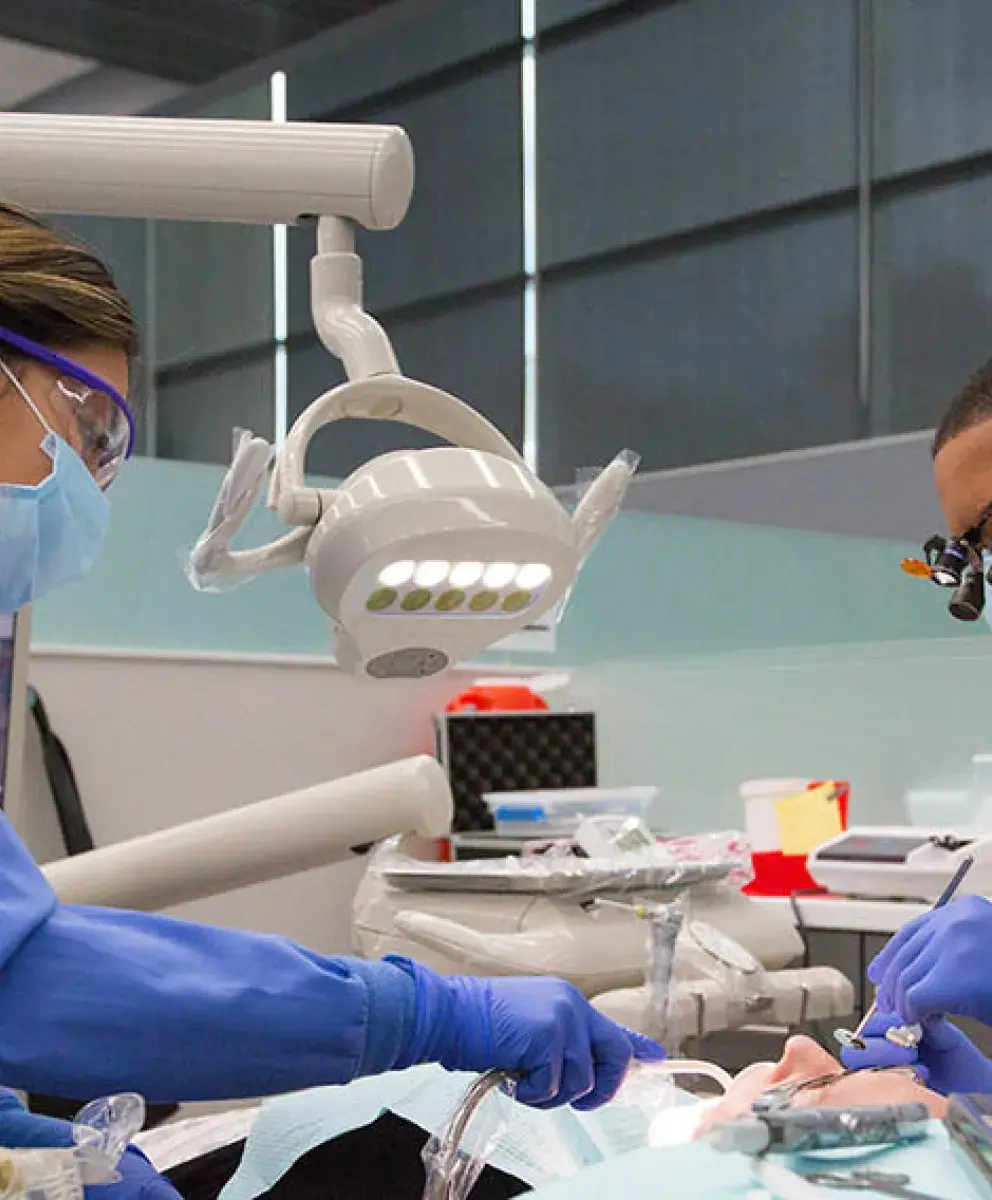 Creighton dental students practicing their craft.