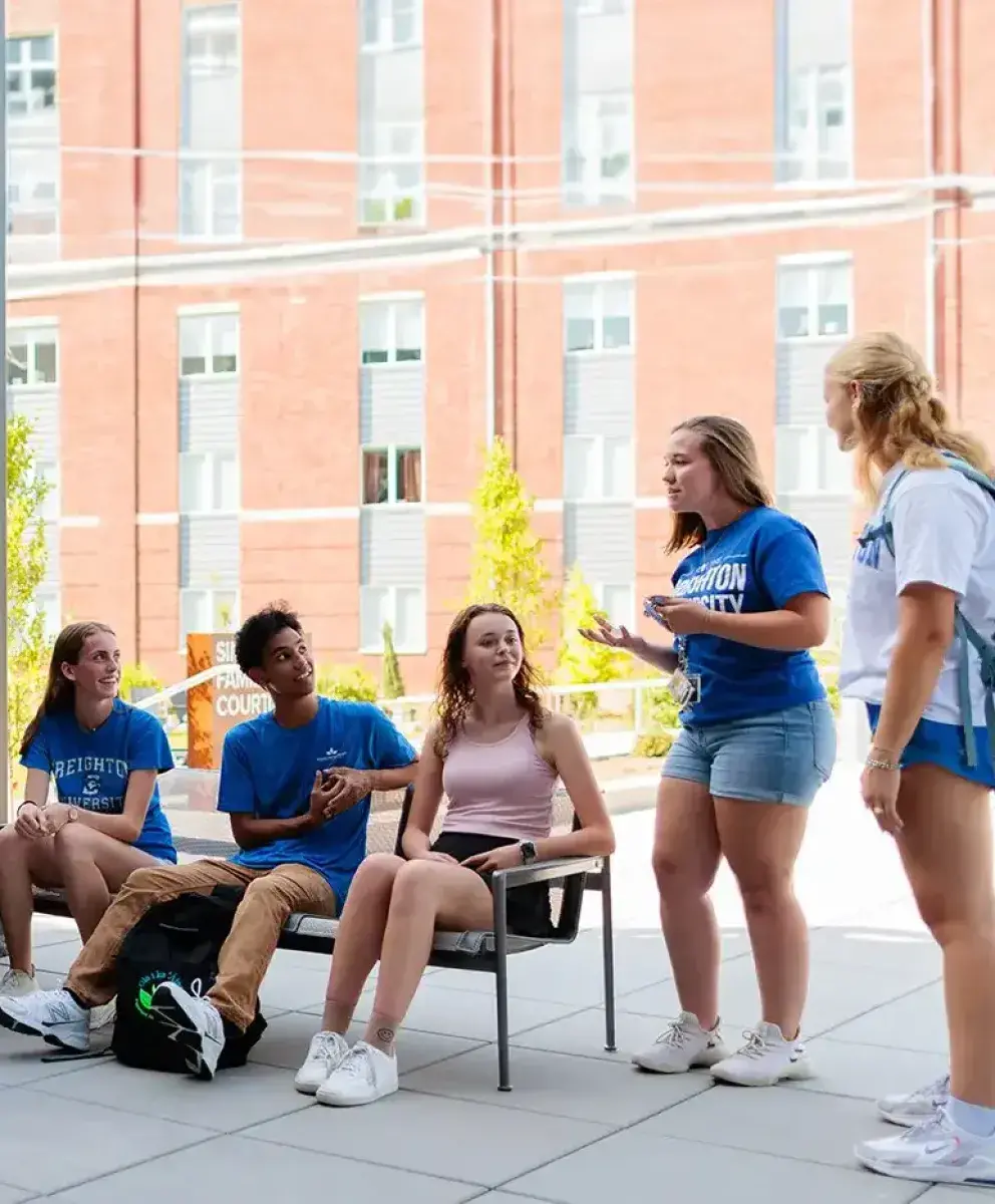 Big group of students socializing in resident hall.
