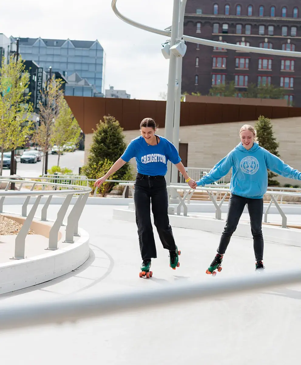 Students rollerskating downtown