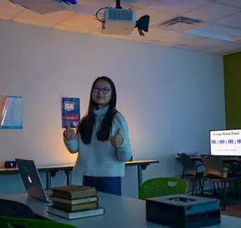 Radlab intern during setup of cybersecurity escape room