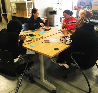 Young women Upward Bound students participating in a design thinking challenge