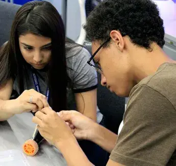 Upward Bound students assembling a Raspberry Pi controlled robotic vehicle