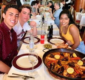 Students eating a meal in their study abroad location