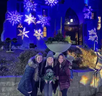 Eva Tersteeg and friends in front of St. John's Church at Christmas