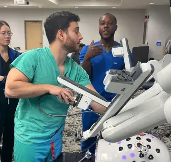 Instructor teaching robotic surgery