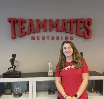 Julia Staniszewski posing in TeamMates mentoring area.