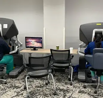 Students performing robotic surgery