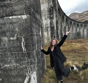 person by railway bridge