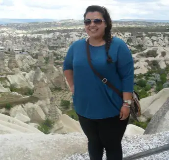 person standing near rocks
