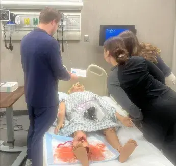 Interprofessional team reviewing clues for escape room activity