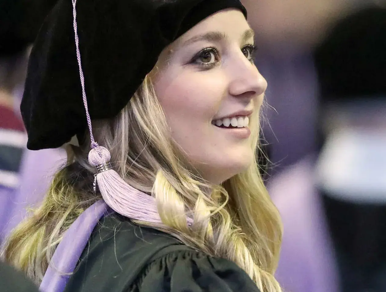 Creighton student at graduation, becoming an alumna