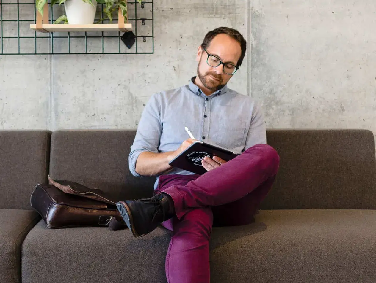Graduate student sitting on couch