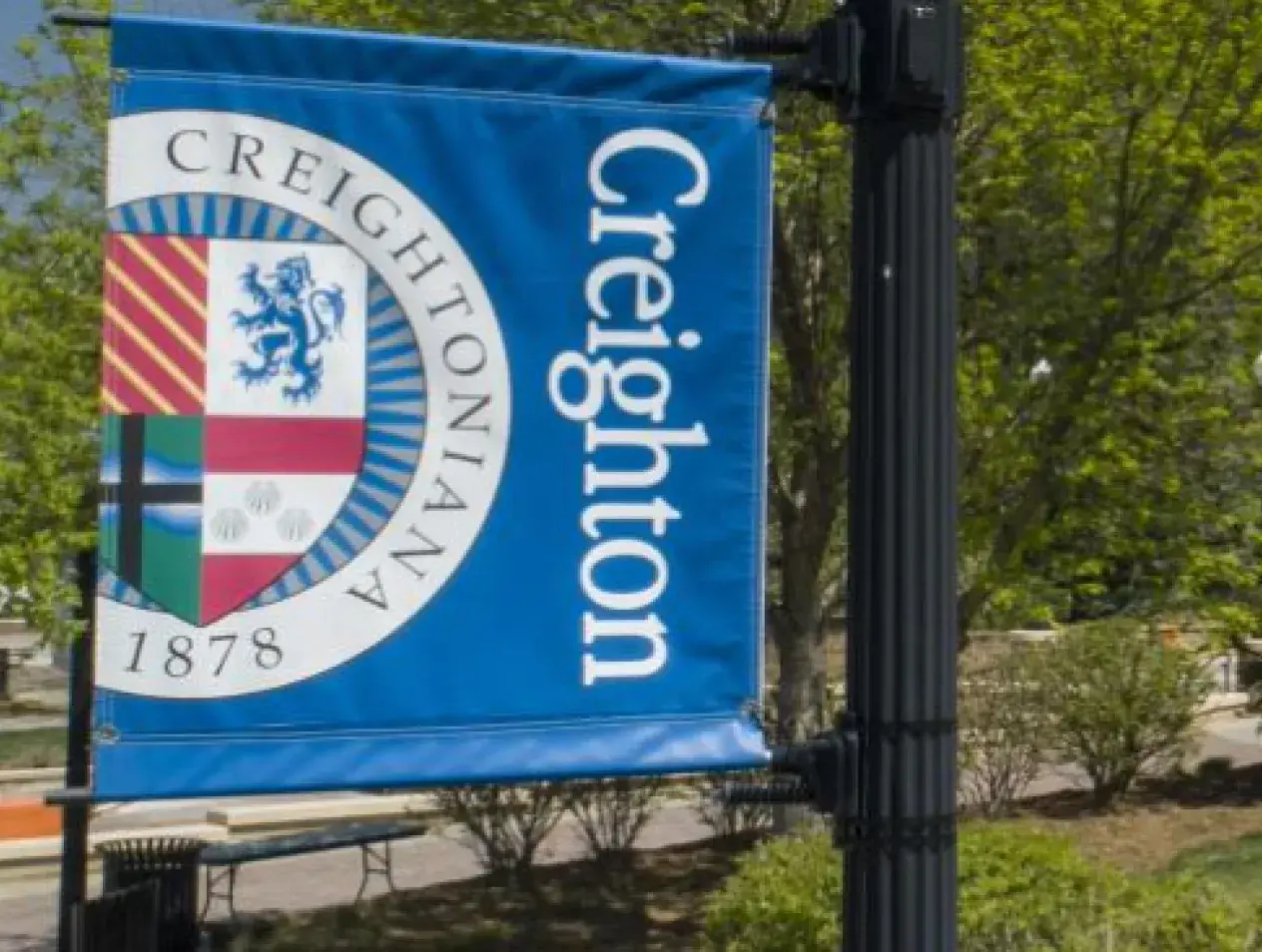 Creighton campus signage banner on sunny day