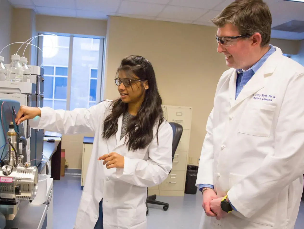 Resident with professor in lab