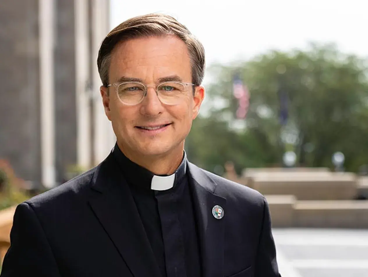 President Daniel Hendrickson smiling on campus