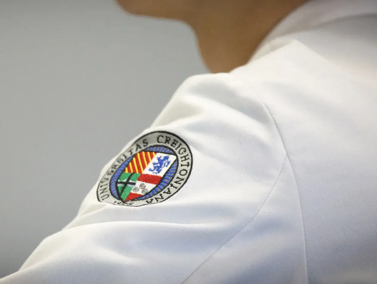 White coat Creighton badge