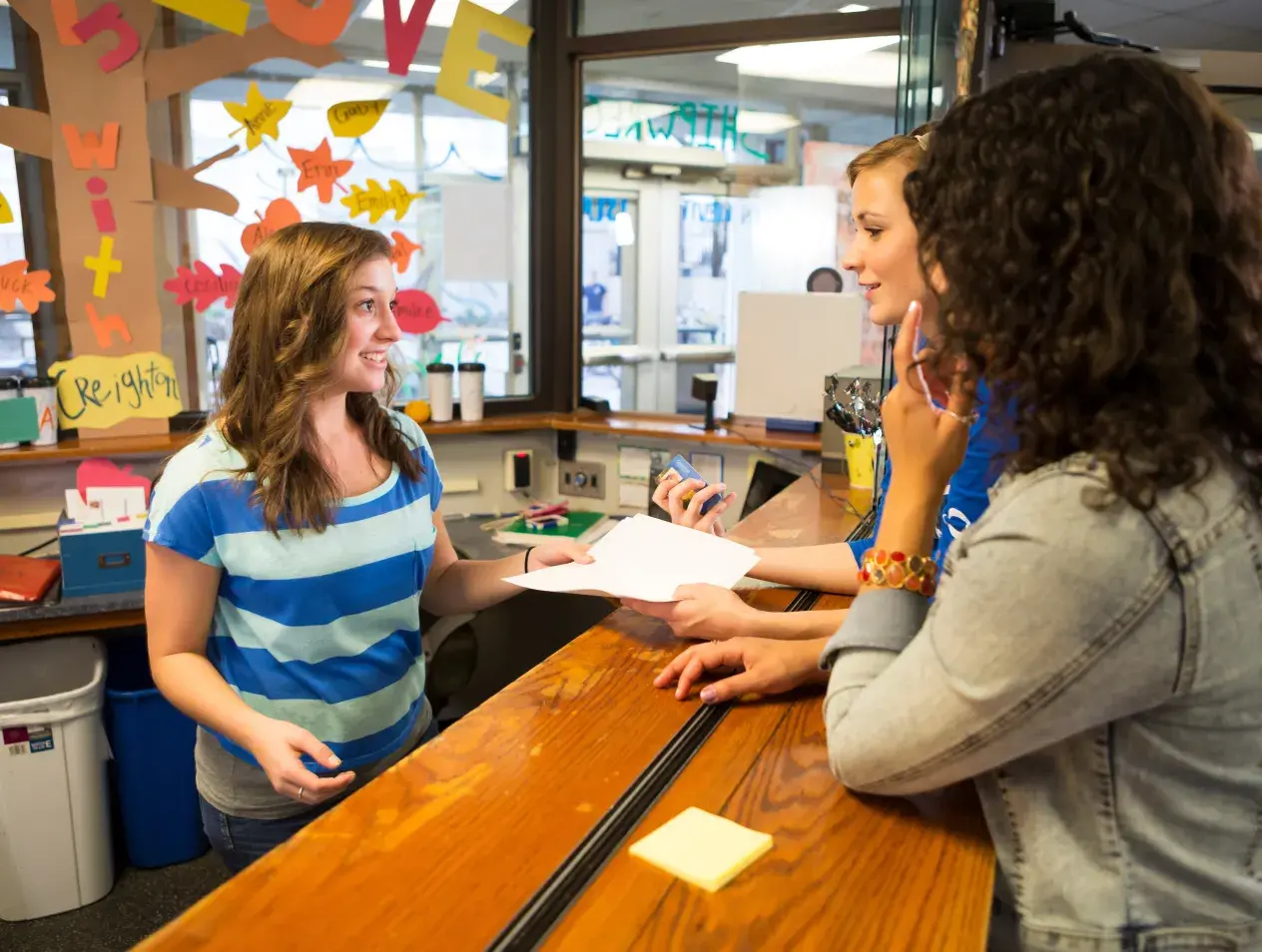 Students at a Residence Hall Desk