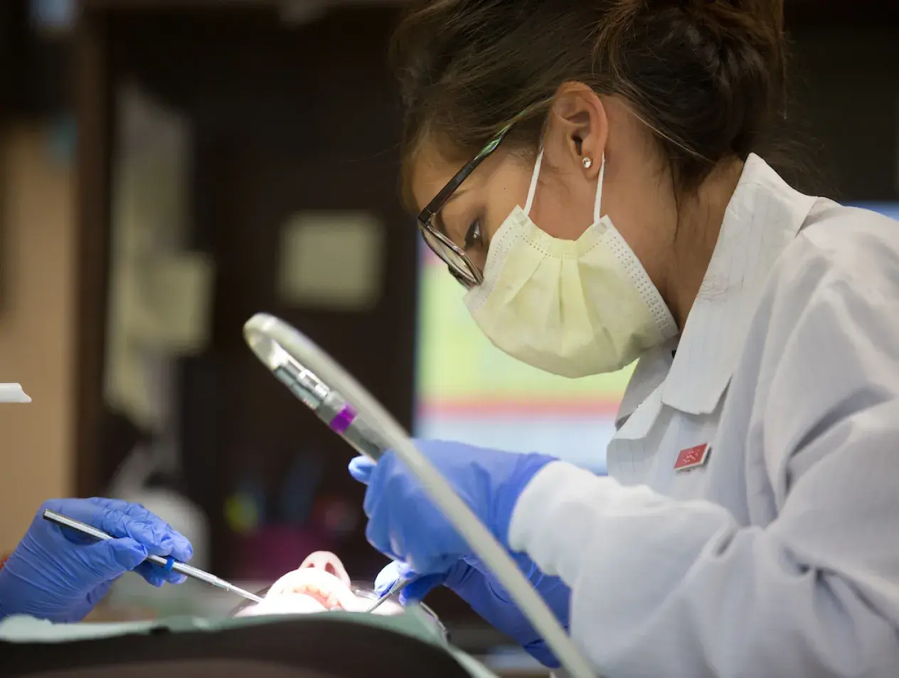 Examining dental patient