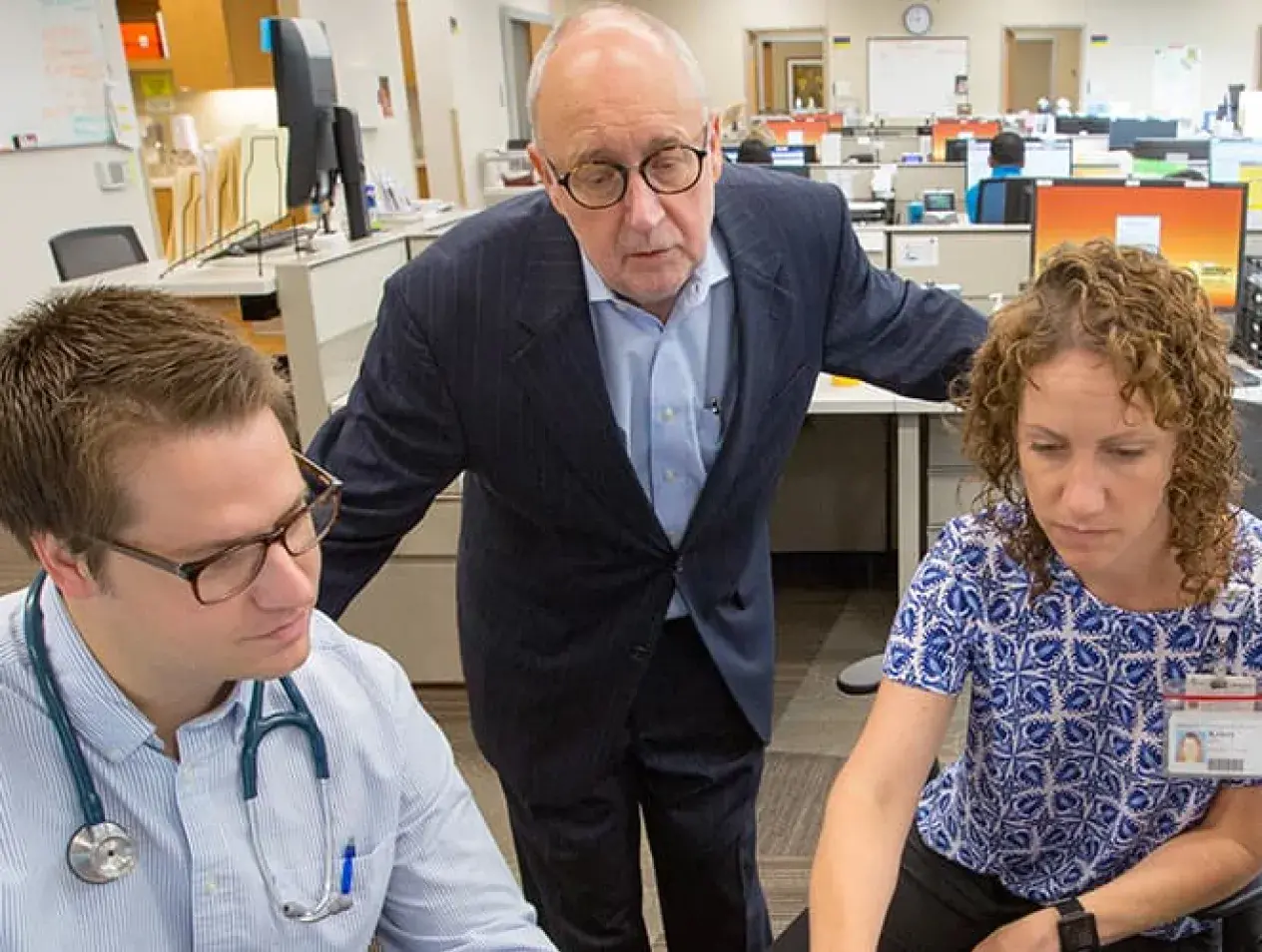 Faculty and students collaborating