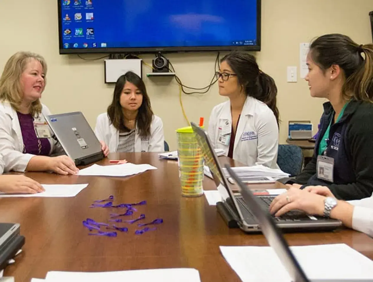 Students and faculty collaborating over research