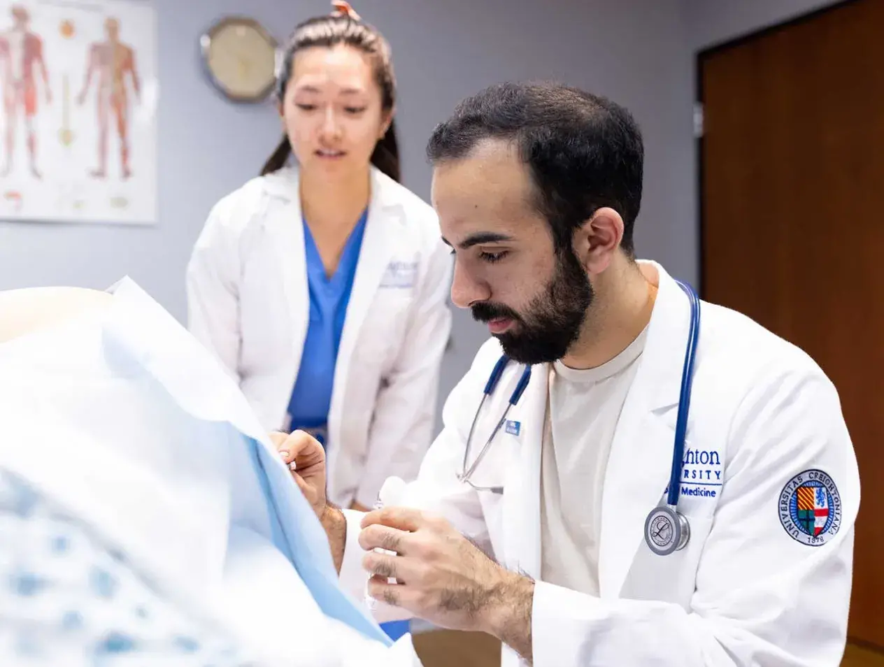 Students helping patient