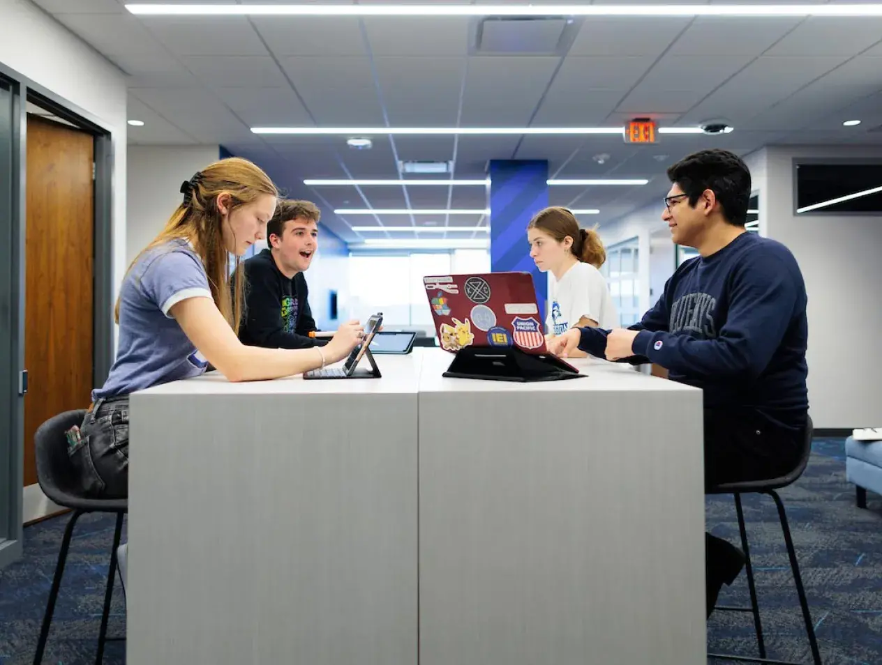Business Fellows studying together at a table in Heider College of Business.