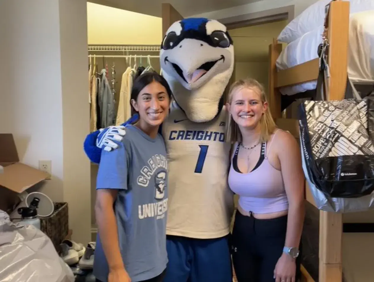 Two students with Billy the Bluejay