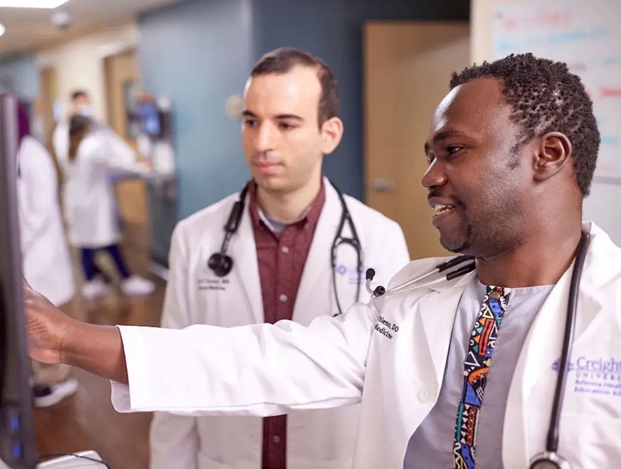Residents going over data in hospital.
