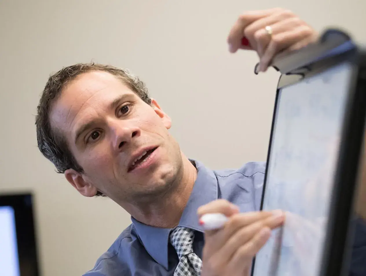 Professor teaching from the board