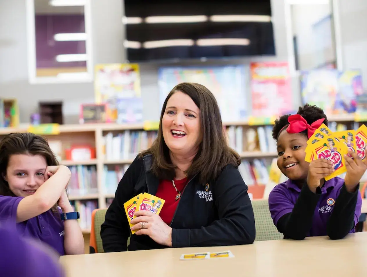 Elementary teacher in classroom setting with students