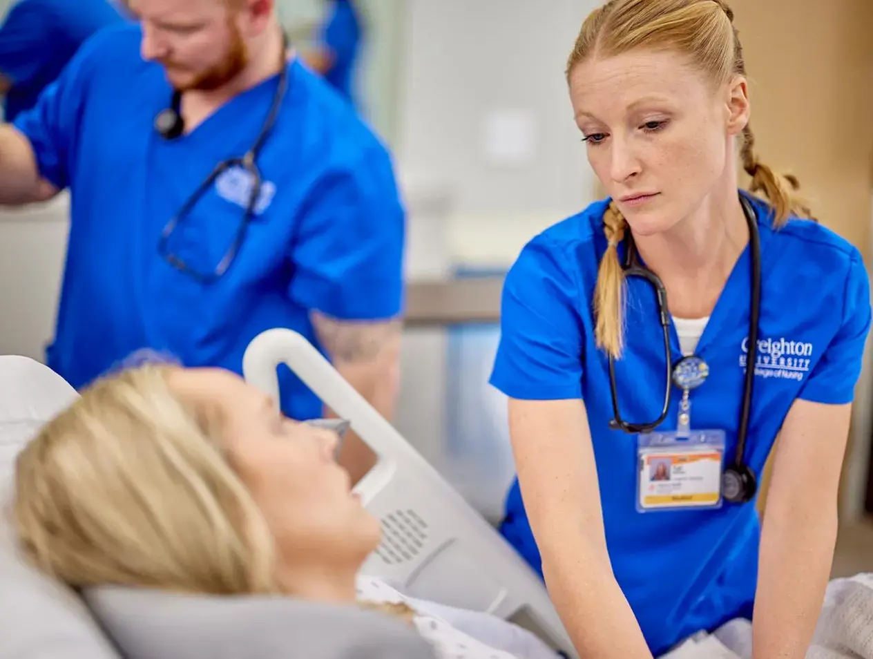 Two nurses with patient
