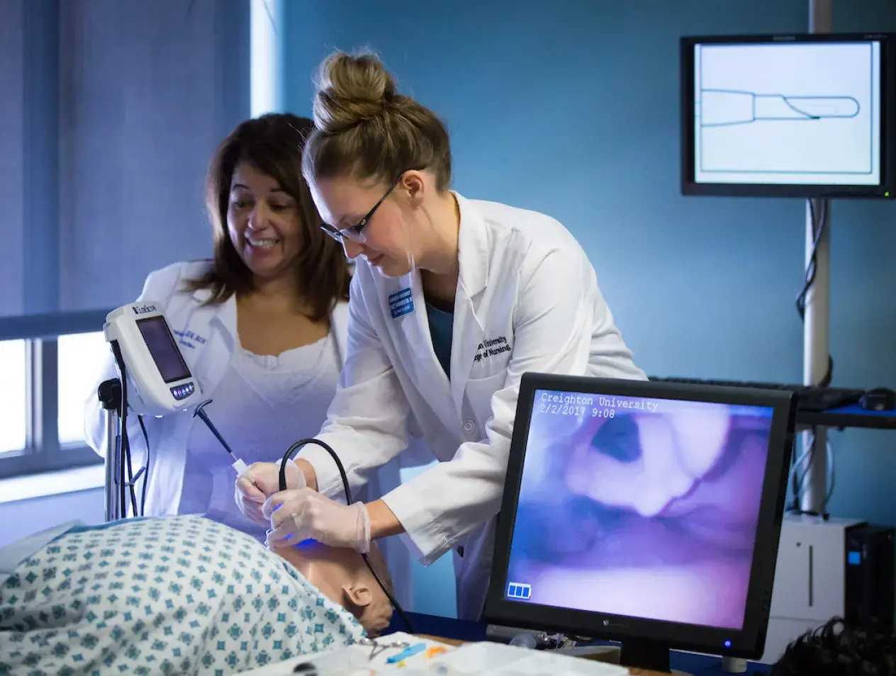 Nursing student using scope