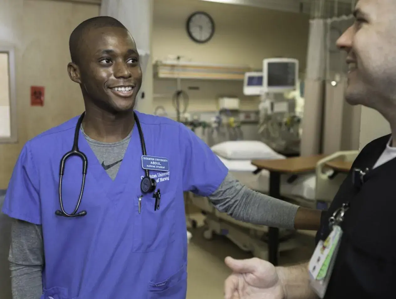 Abdul Tholley nursing student talking and smiling