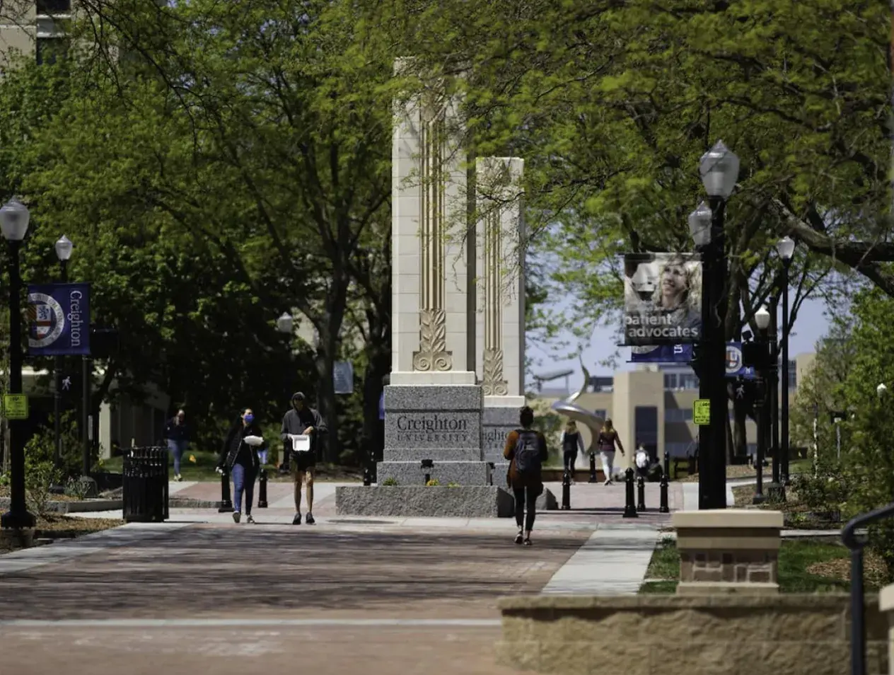 Creighton mall corridor students walking on sunny day
