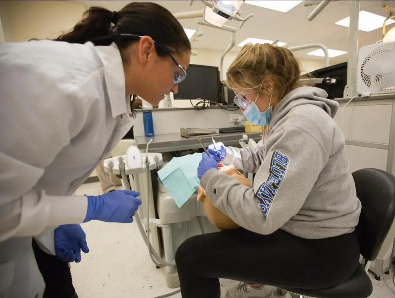 Two dental students in simulation lab
