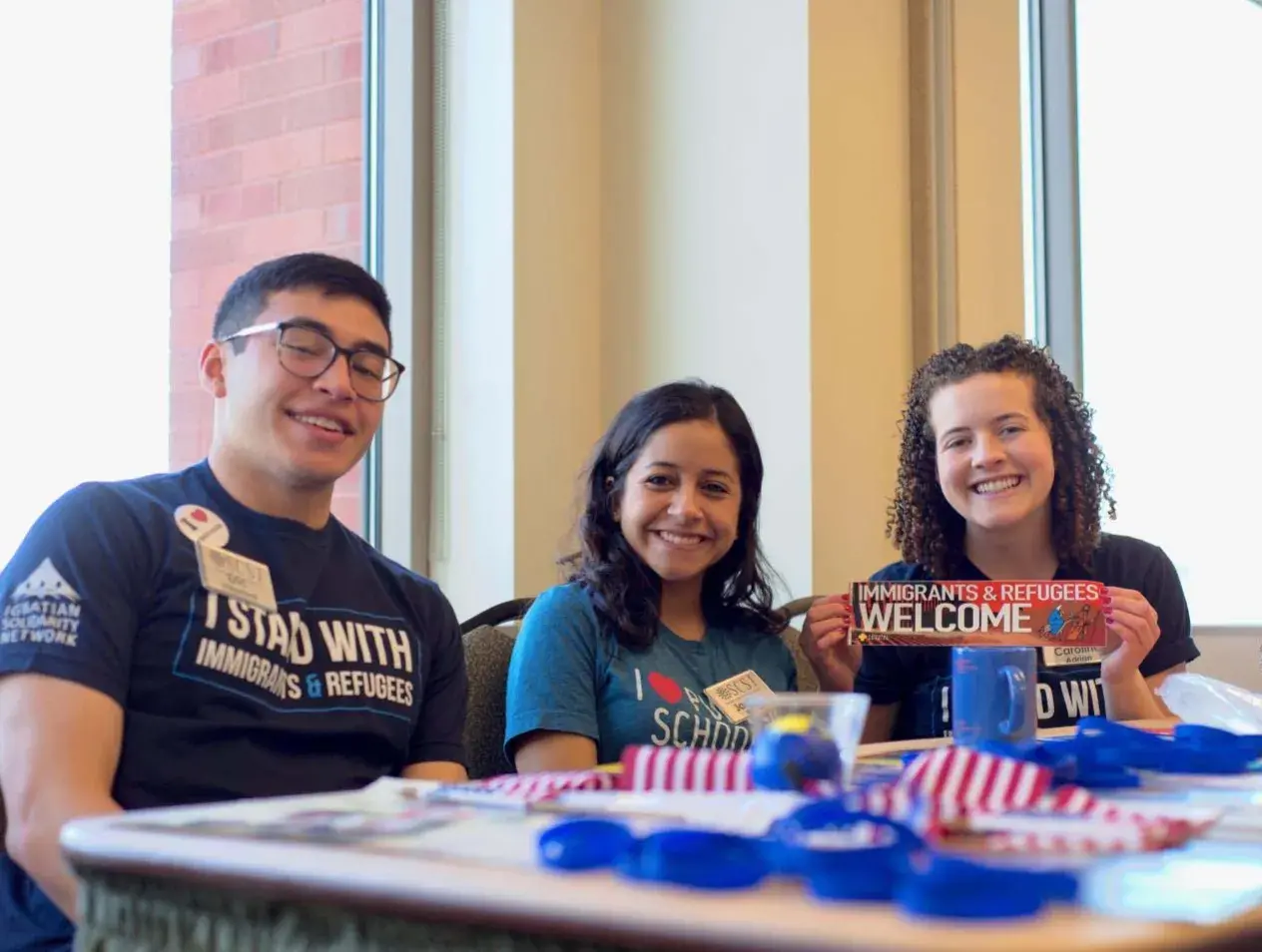 students at refugee table
