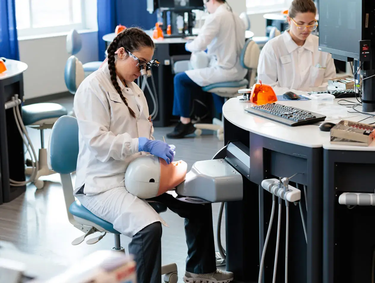 Dentists training on dummy