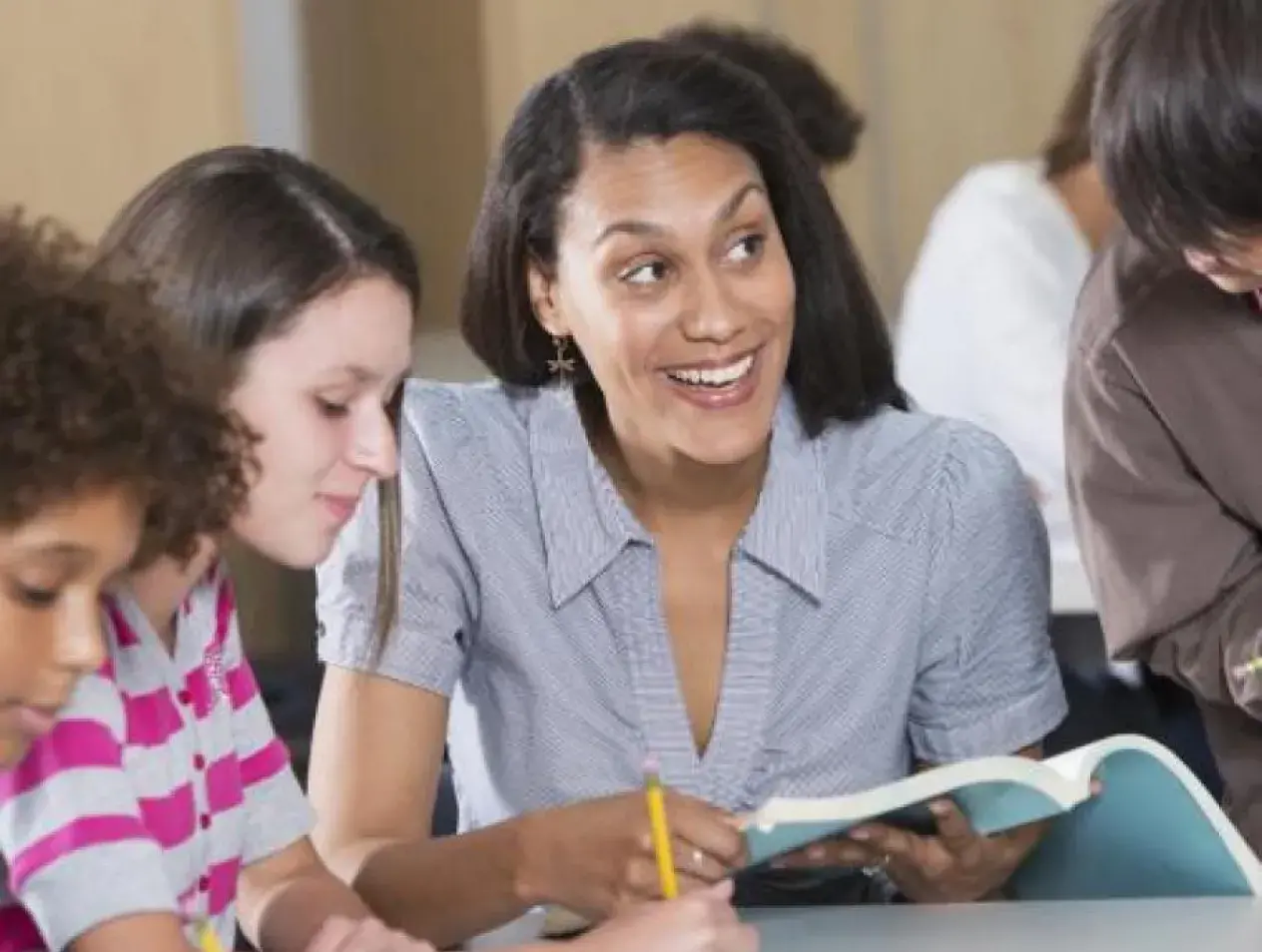 Teacher working with students
