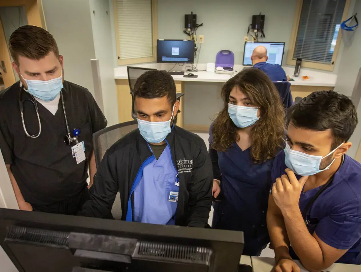Internal med residents on computer