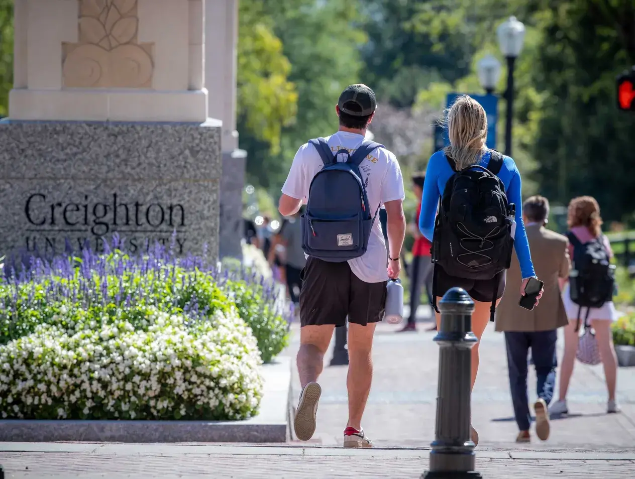 Creighton students walking on the mall