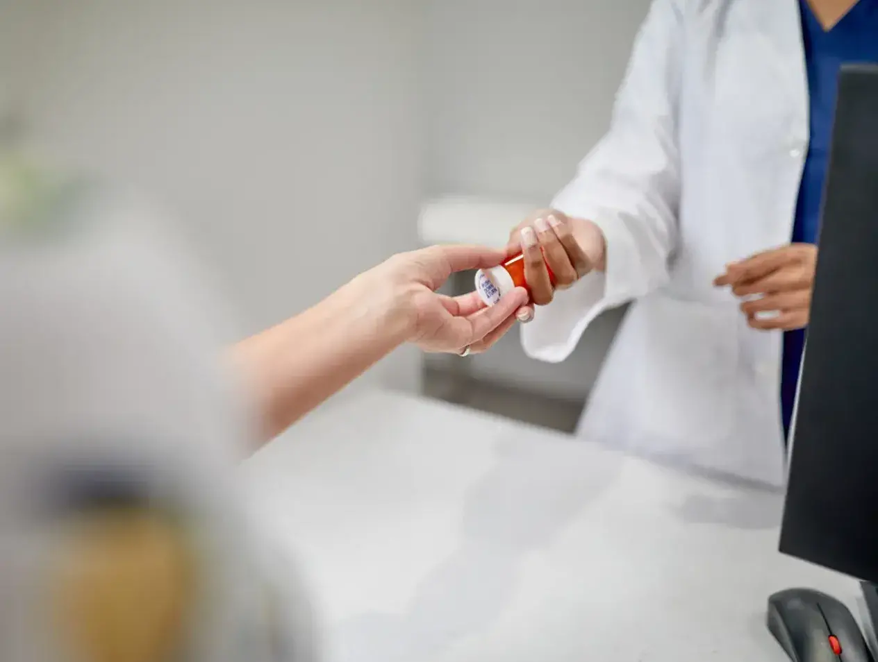 Pharmacist with patient