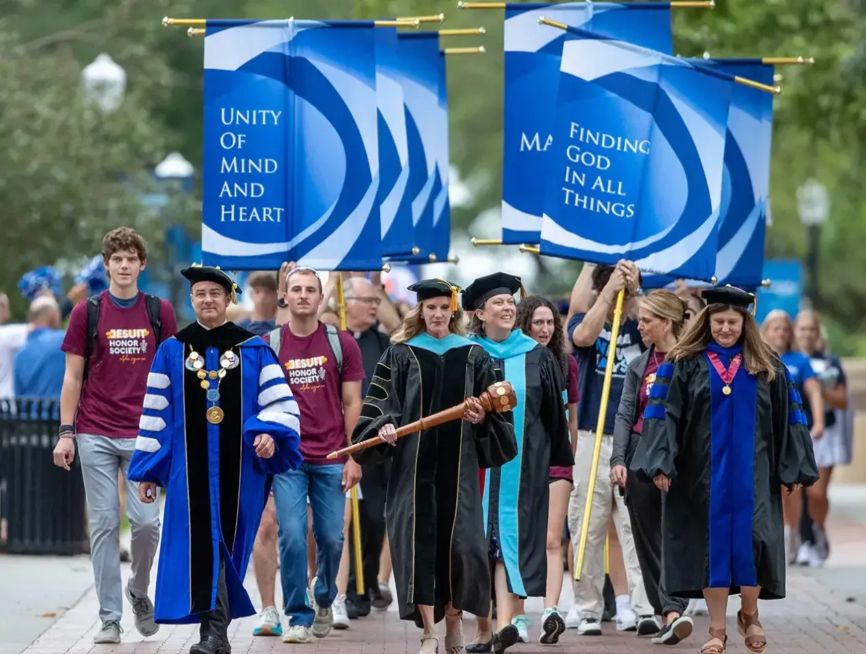 Honor society student procession on campus.